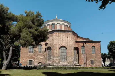 Historic Hagia Eirene Church in Istanbul under clear blue skies, showcasing Byzantine architecture.